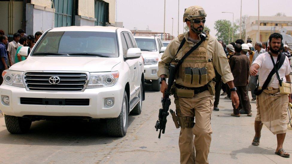 A UAE soldier escorts a Yemeni government convoy in the Red Sea port city of Mokha, Yemen (6 August 2017)