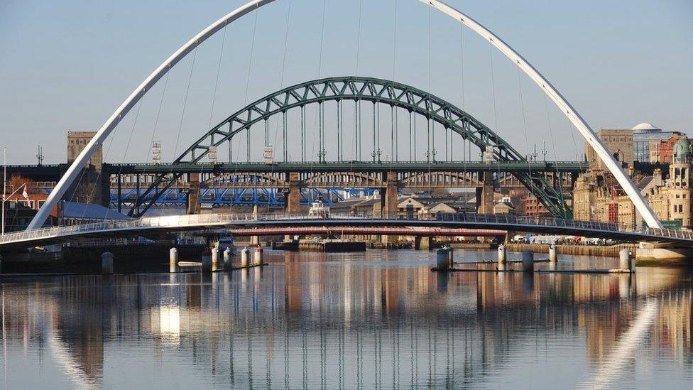 Gateshead Millennium Bridge (foreground) with Tyne Bridge (background)