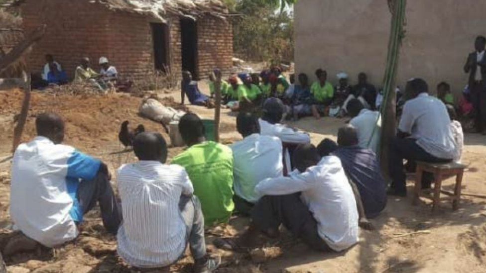 Farmers listening to a lesson