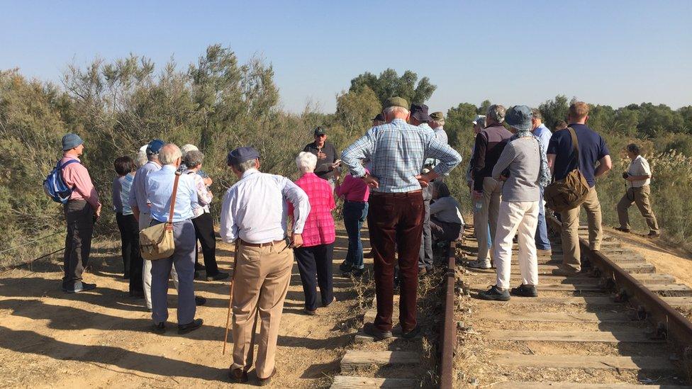 British tour group at railway remains