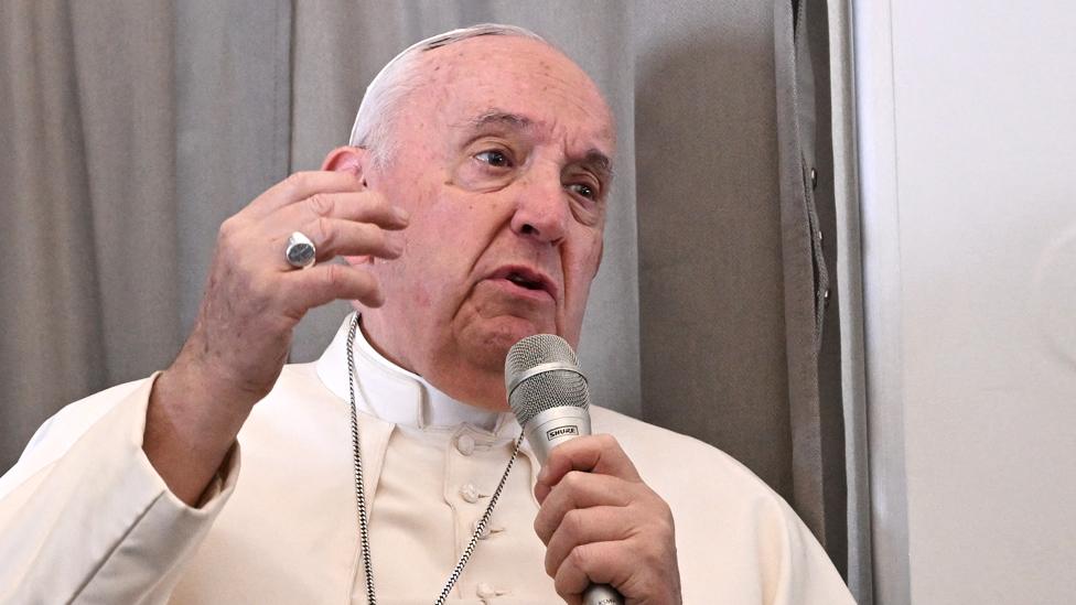 Pope Francis addresses the media while aboard the plane from Juba to Rome