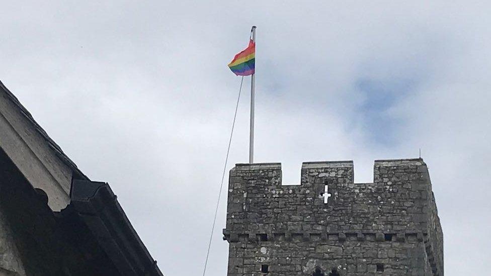 Rainbow flag on top of St Illtud's church