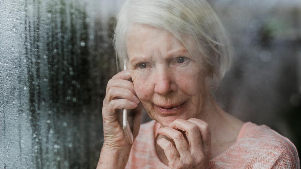 Worried woman on phone