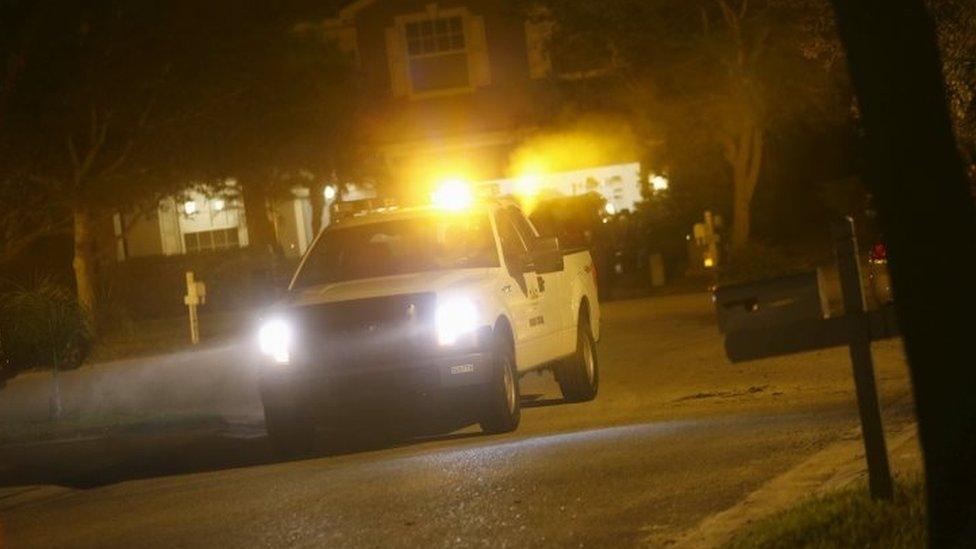 A mosquito control vehicle drives through a neighborhood spraying against the insects in Hillsborough County, Florida (03 February 2016)