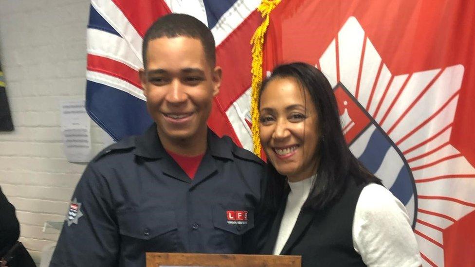 Jaden's mother Linda Francois, right, with her son, left as he picked up a certificate