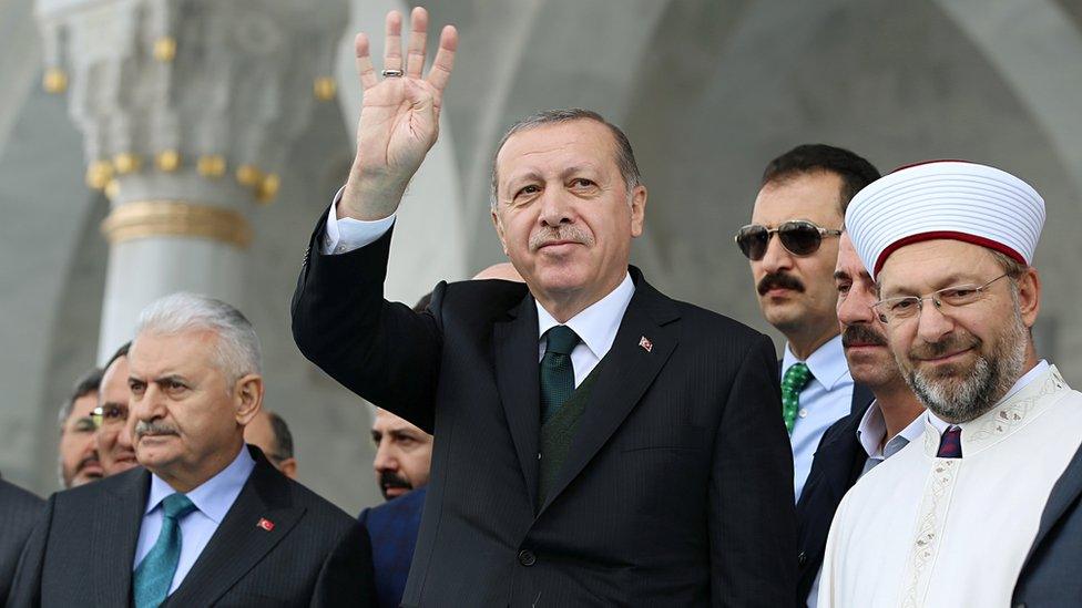 Turkish President Tayyip Erdogan greets people during the opening ceremony of a mosque in Ankara, Turkey, October 27, 2017