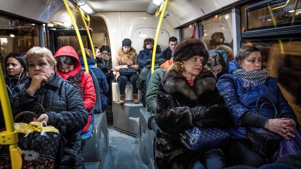 Unhappy people sitting on a bus in Moscow