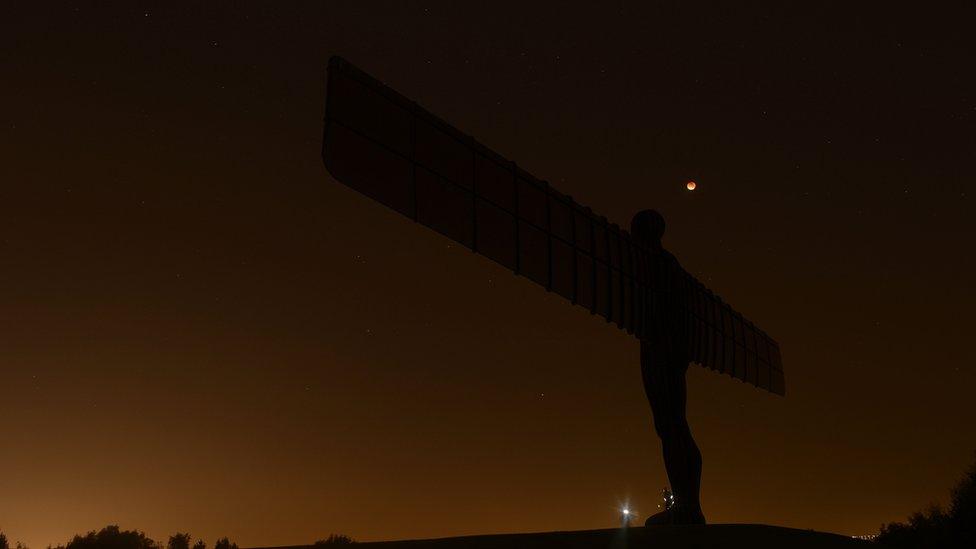 The Angel of North and the lunar eclipse