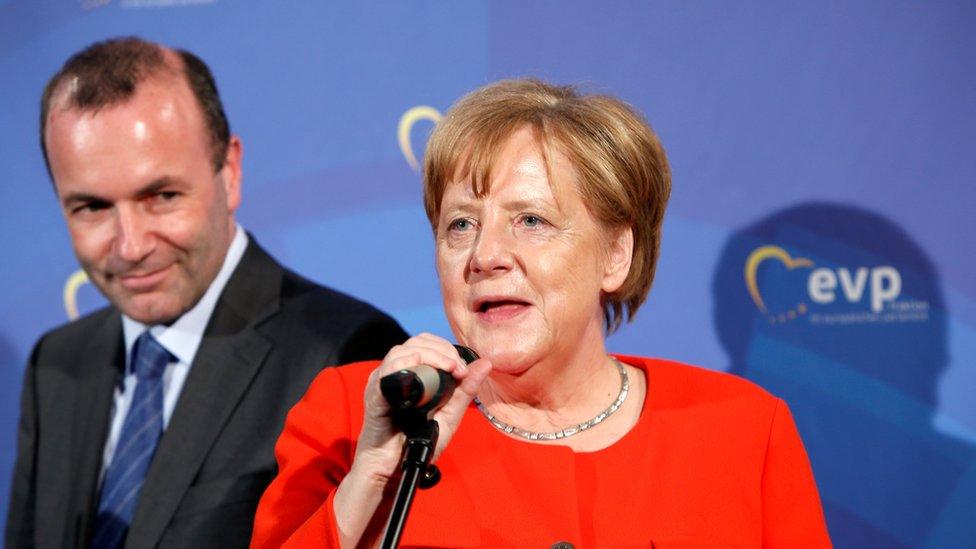 German Chancellor Angela Merkel (CDU) speaks next to Manfred Weber