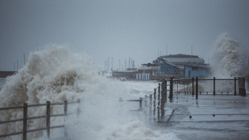 A wave crashes against the sea front in Ramsgate in Kent