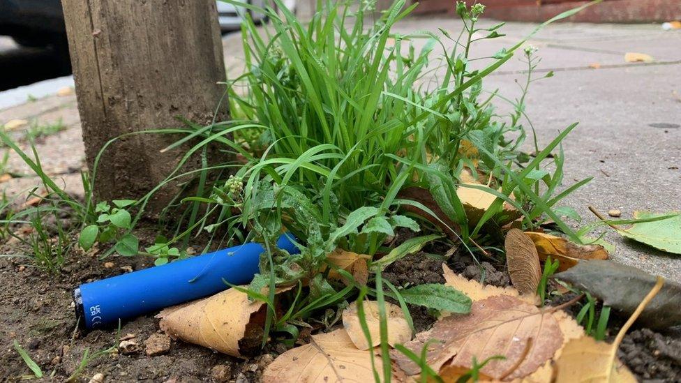 Disposable vape discarded on the pavement