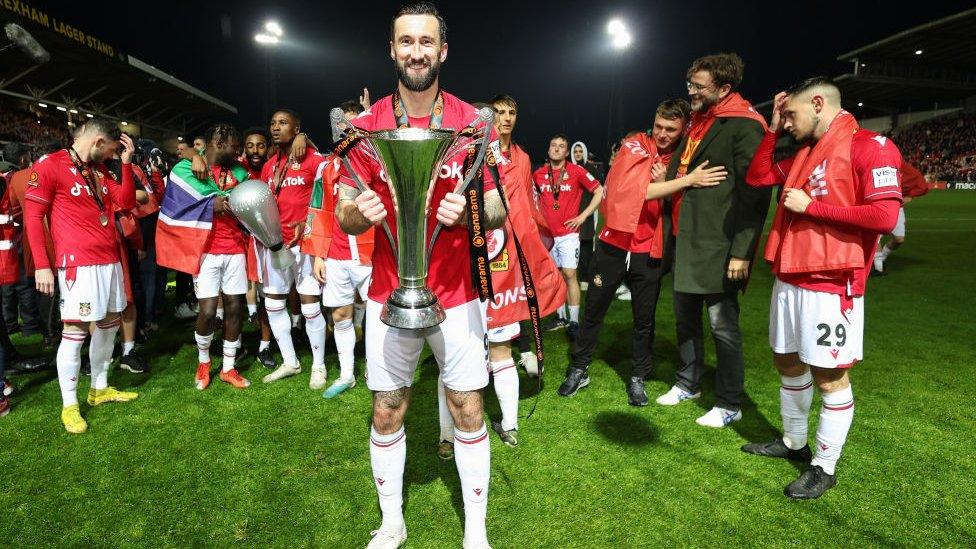 Ollie Palmer holds trophy