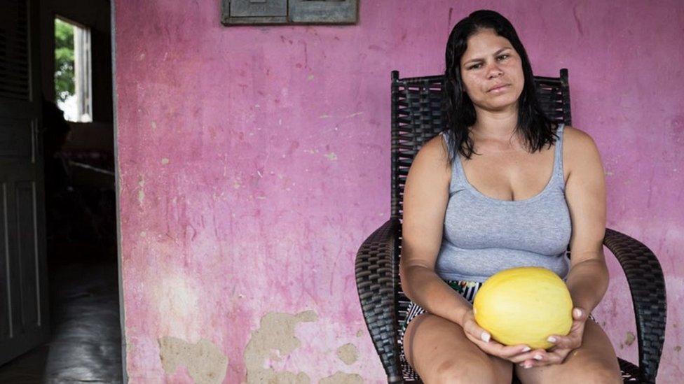 Carmen Priscilla Souza in front of her house in Rio Grande do Norte