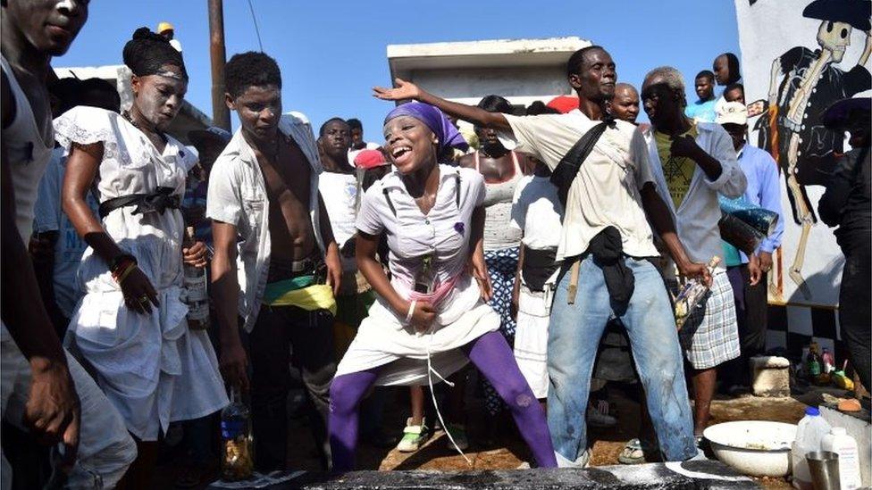 Voodoo followers take part in ceremonies honouring the Haitian voodoo spirits of Baron Samdi and Gede during Day of the Dead in Port-au-Prince on 1 November, 2015