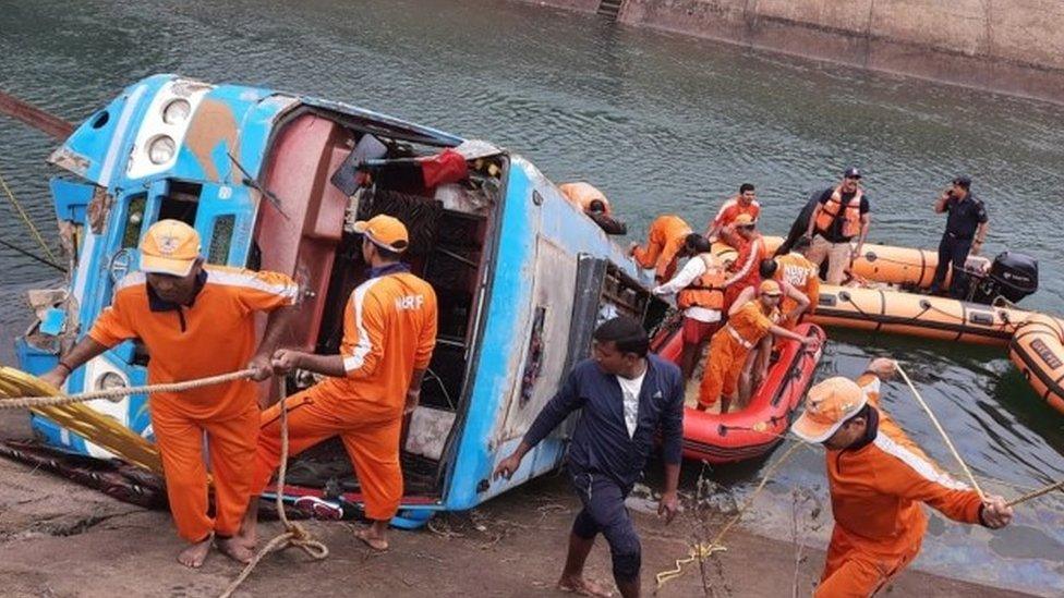 National Disaster Response Force (NDRF) personnel conduct a rescue operation at the site after a bus in fell into a canal in Sidhi Madhya Pradesh, India, 16 February 2021.