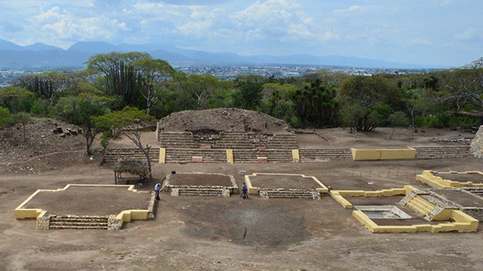 A wider shot of the site showing scale of ruins