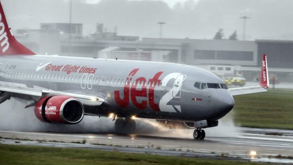 A plane lands in torrential rain at Leeds Bradford Airport