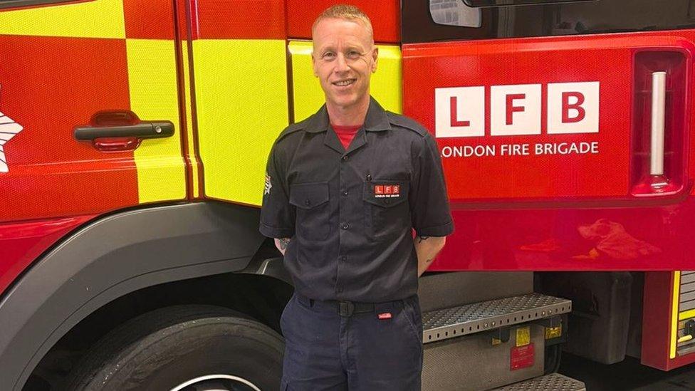 Steve Moore in front of a London Fire Brigade truck