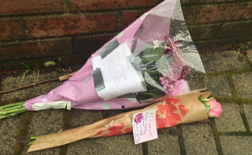 Bouquets near to scene where body found by police searching for Caroline Everest