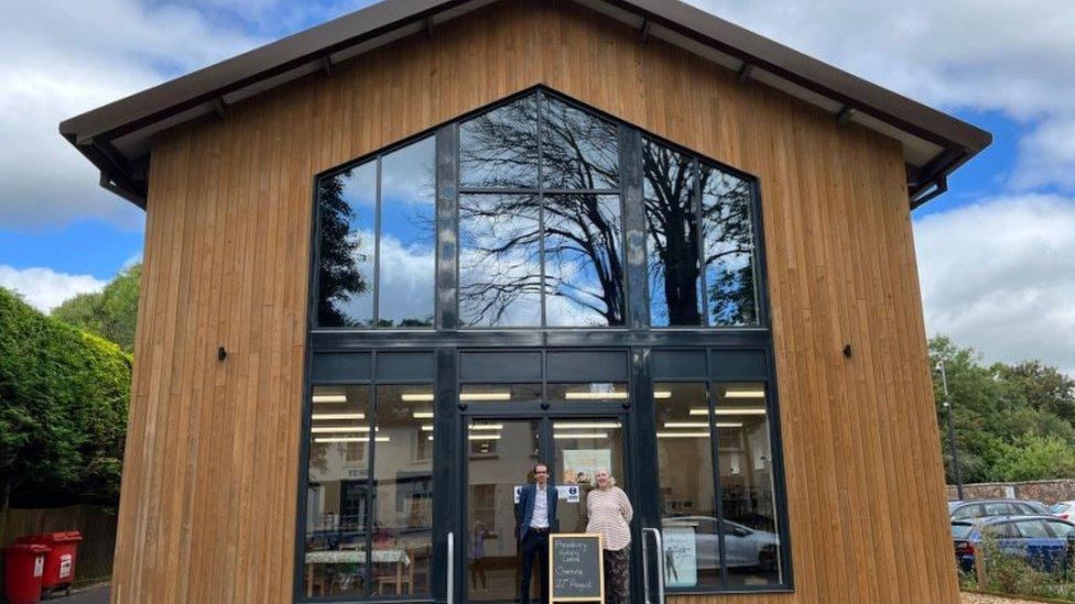 Mark and Christina outside the new building