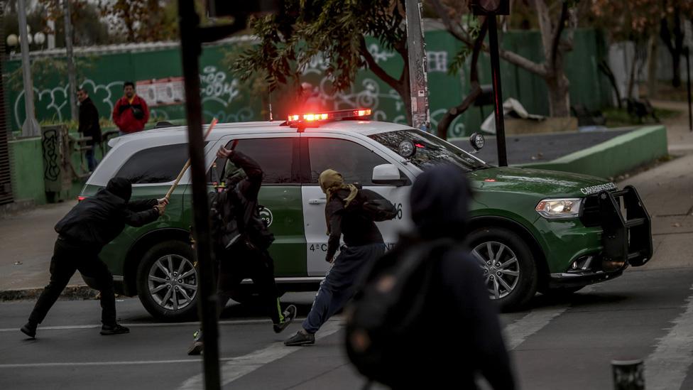 Secondary students face police in the centre of the city of Santiago during the demonstration against the bill promoted by the government of Sebastian Piñera, in Santiago, Chile, on June 24, 2019.