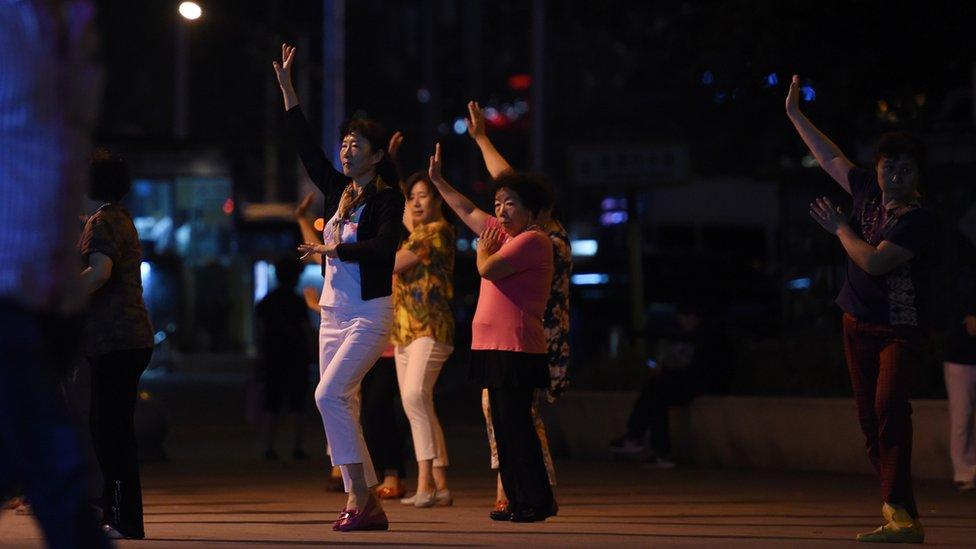 Chinese women dancing in a public space