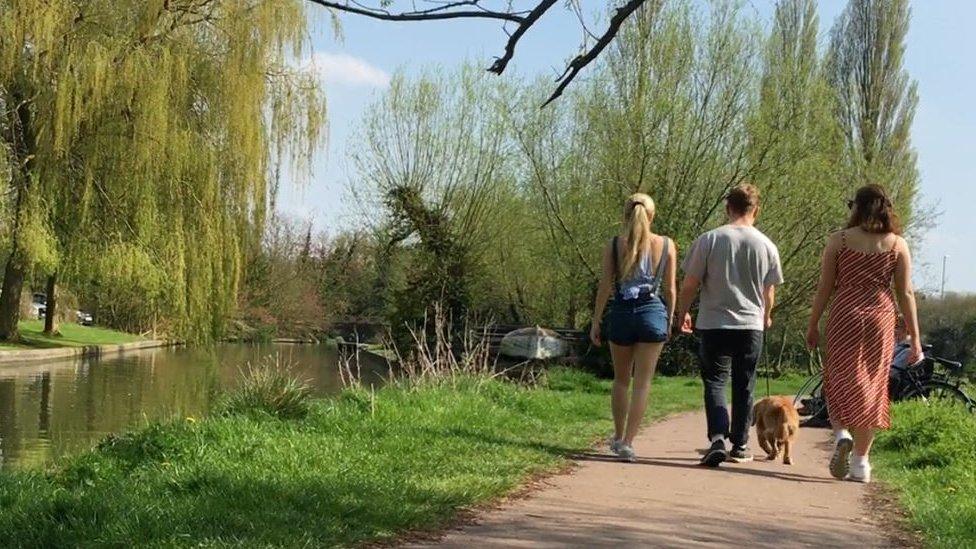 Students walking Jack the dog