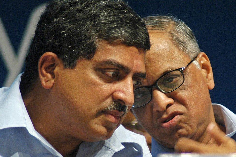 Chairman and chief mentor of Infosys Technologies, Narayan Murthy (R) discusses with co-chairman Nandan M Nilekani