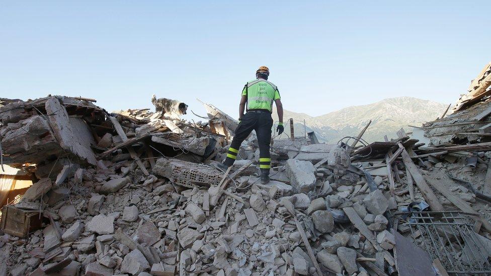 A rescuer in Amatrice on 27 August, 2016