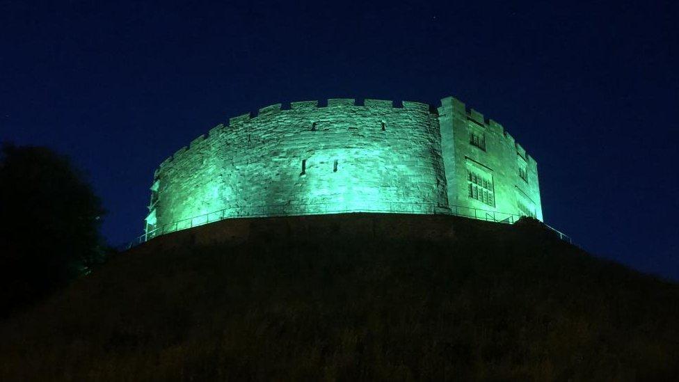 Tamworth Castle lit up in green