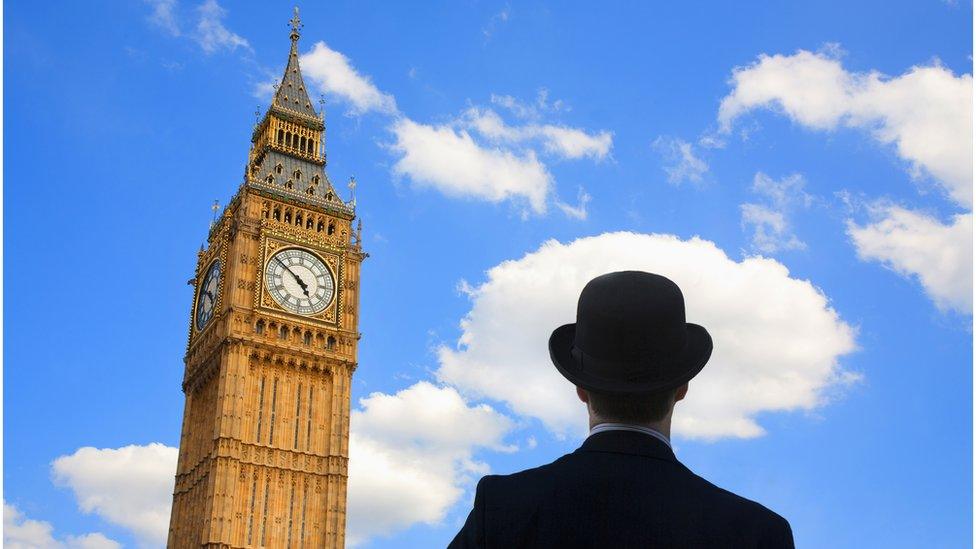 Man in bowler hat near Big Ben