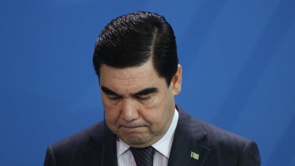 Gurbanguly Berdymukhamedov looking downward