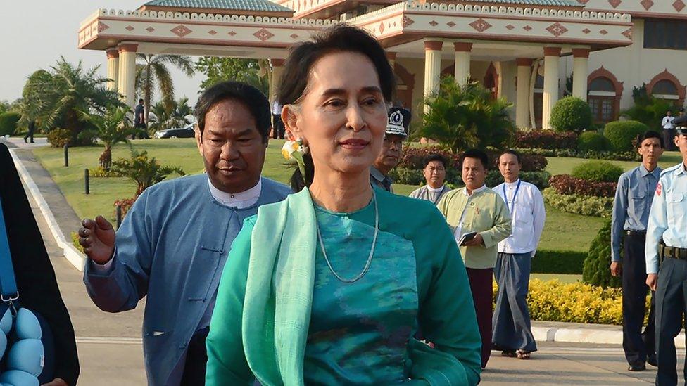 Myanmar State Counsellor and Foreign Minister Aung San Suu Kyi prepares to depart with President Htin Kyaw