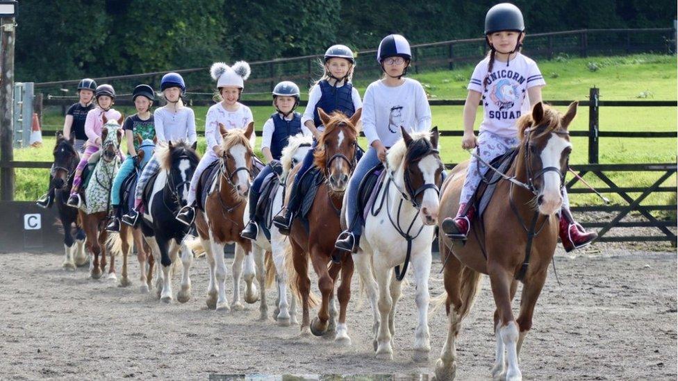 Children riding ponies