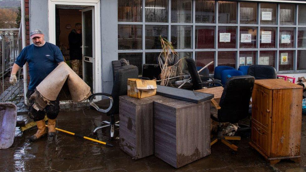 Furniture and carpets outside a community shop and hub in Nantgarw