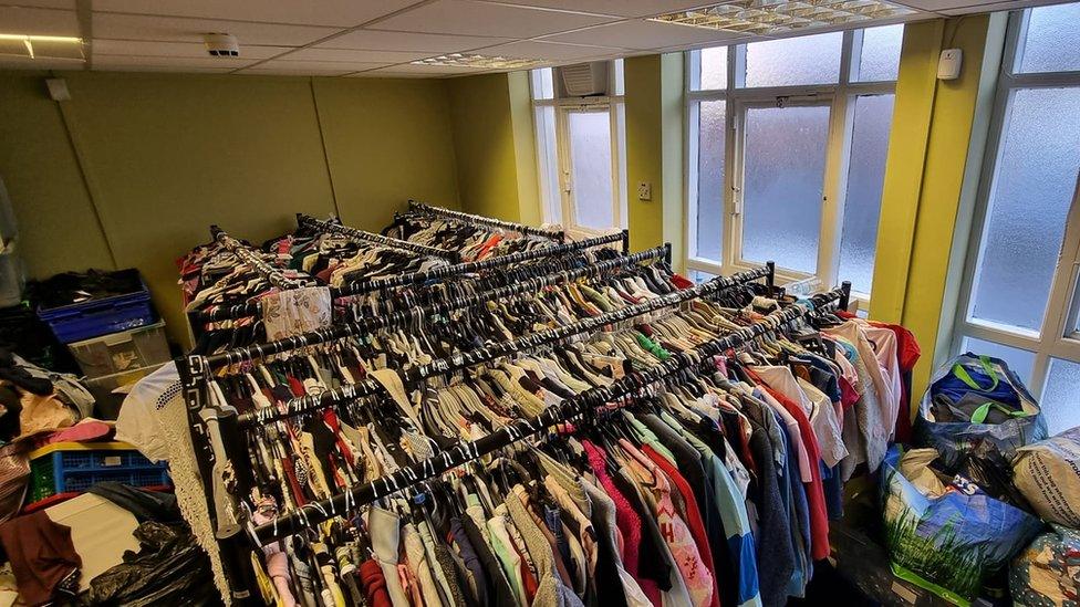 Rail of donated clothing