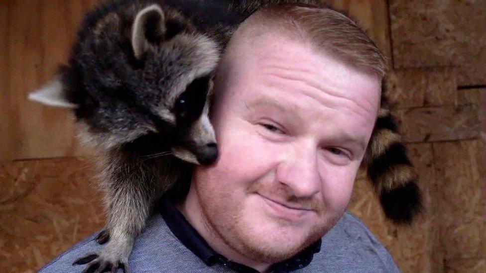 Scott with his raccoon