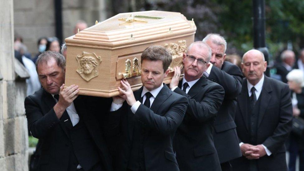 Declan Donnelly carrying the coffin of his brother, Father Dermott Donnelly into St Mary's Cathedral in Newcastle