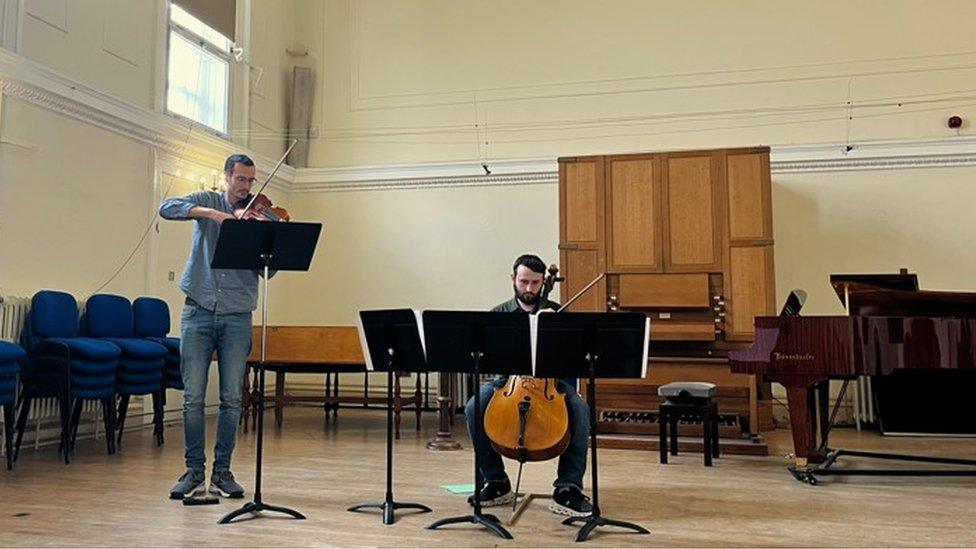 Ricardo Brown on the violin and George Owen on the cello.