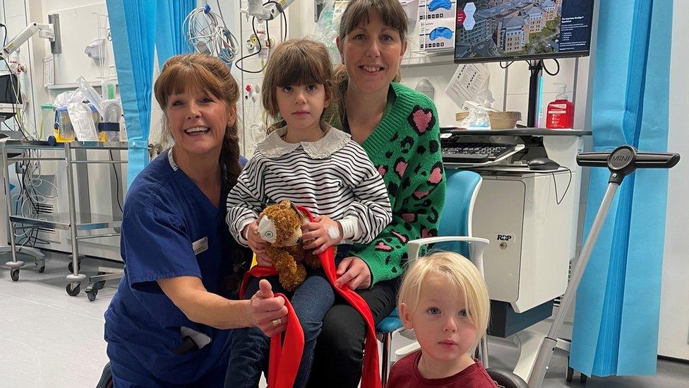 Clinical leader Caroline Bansom (left) with young patients Henriette Johnson and Ronnie Cooper (in the car)