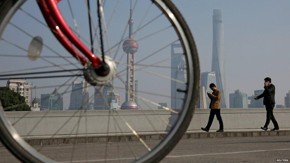 View of the Shanghai skyline with a bike in the foreground