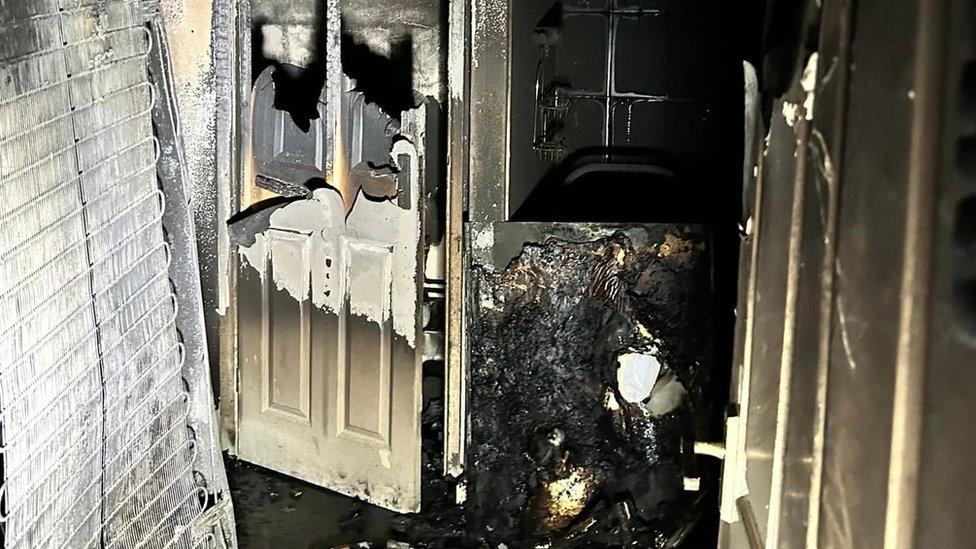 Aftermath of a house fire in Brandon, showing smoke-damaged interiors of the property.