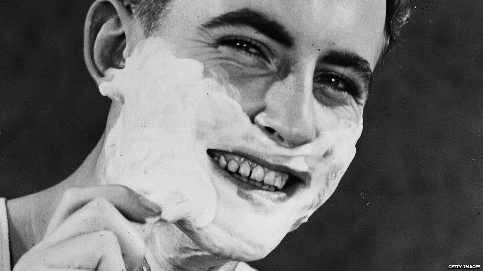 Man shaving his face