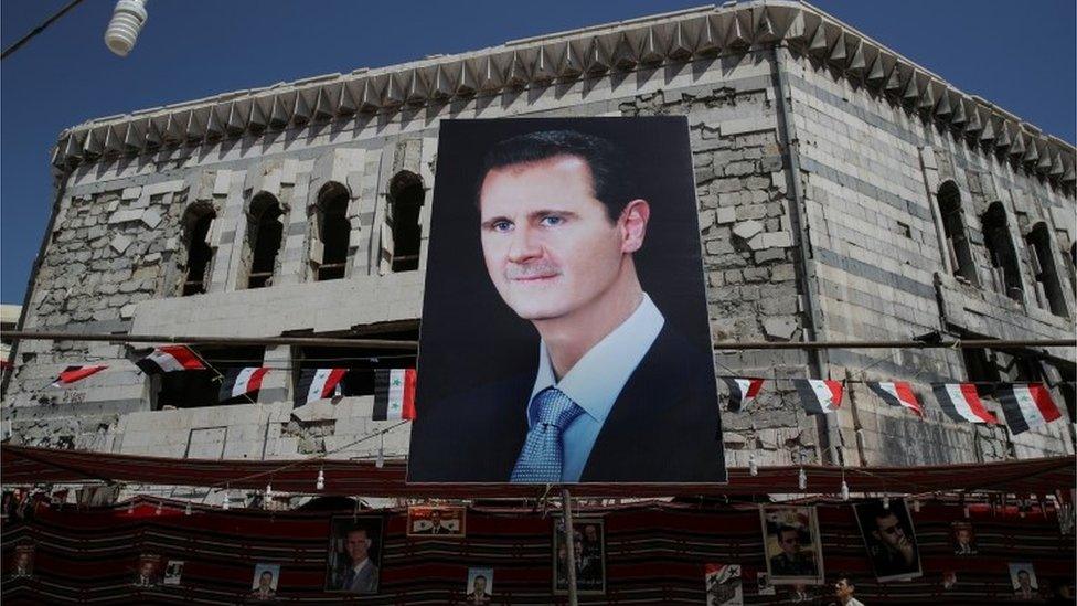 assad banner, 2018