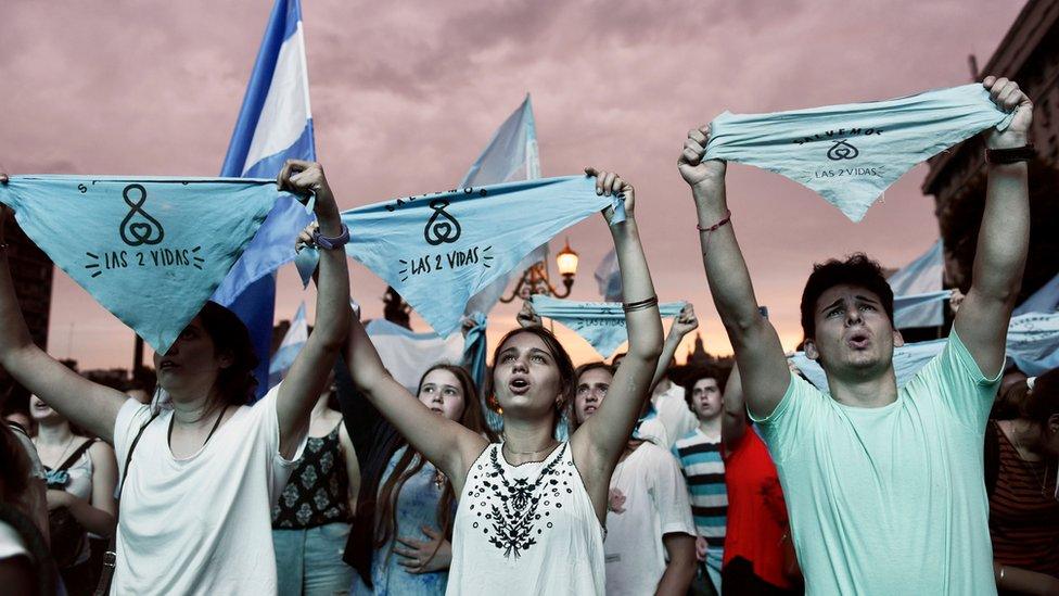 Protesters against legalising abortion carried signs reading "two lives" and wore crosses