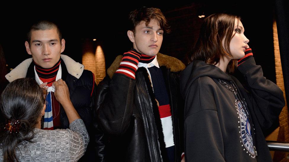 Anwar Hadid (centre) with sister Bella and another male model