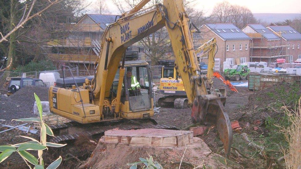 Diggers at the site