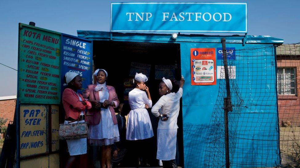 Women queue for food in South Africa