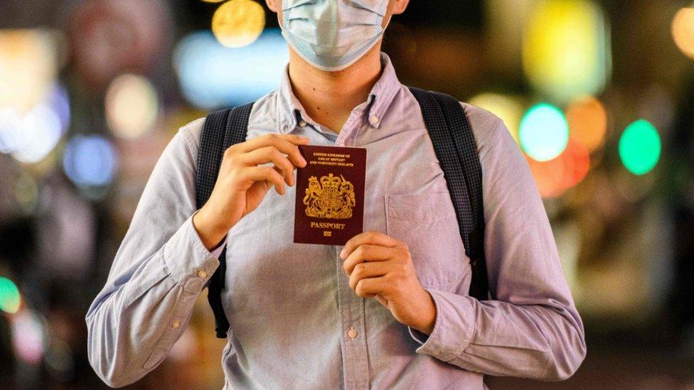 Cropped photographs shows Hong Kong president posing with his British National (Overseas) passport