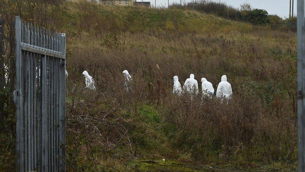 Forensic officers carrying out searches in Strabane